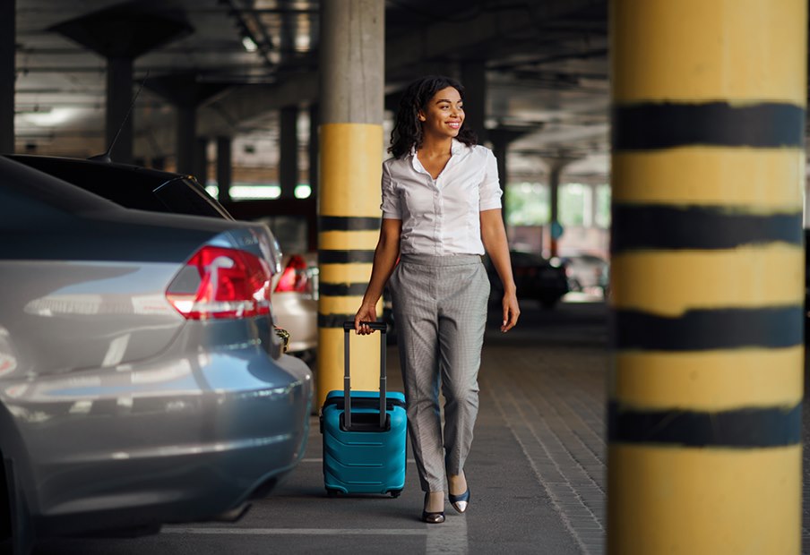Woman walking towards parking of Sheraton Brussels Airport Hotel